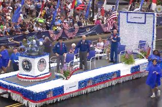 Apollo astronauts Charlie Duke, Harrison Schmitt and Rusty Sweickart join active NASA astronaut Randy Bresnik on the grand marshals float in the National Memorial Day Parade on Monday, May 29, 2023 in Washington, D.C..