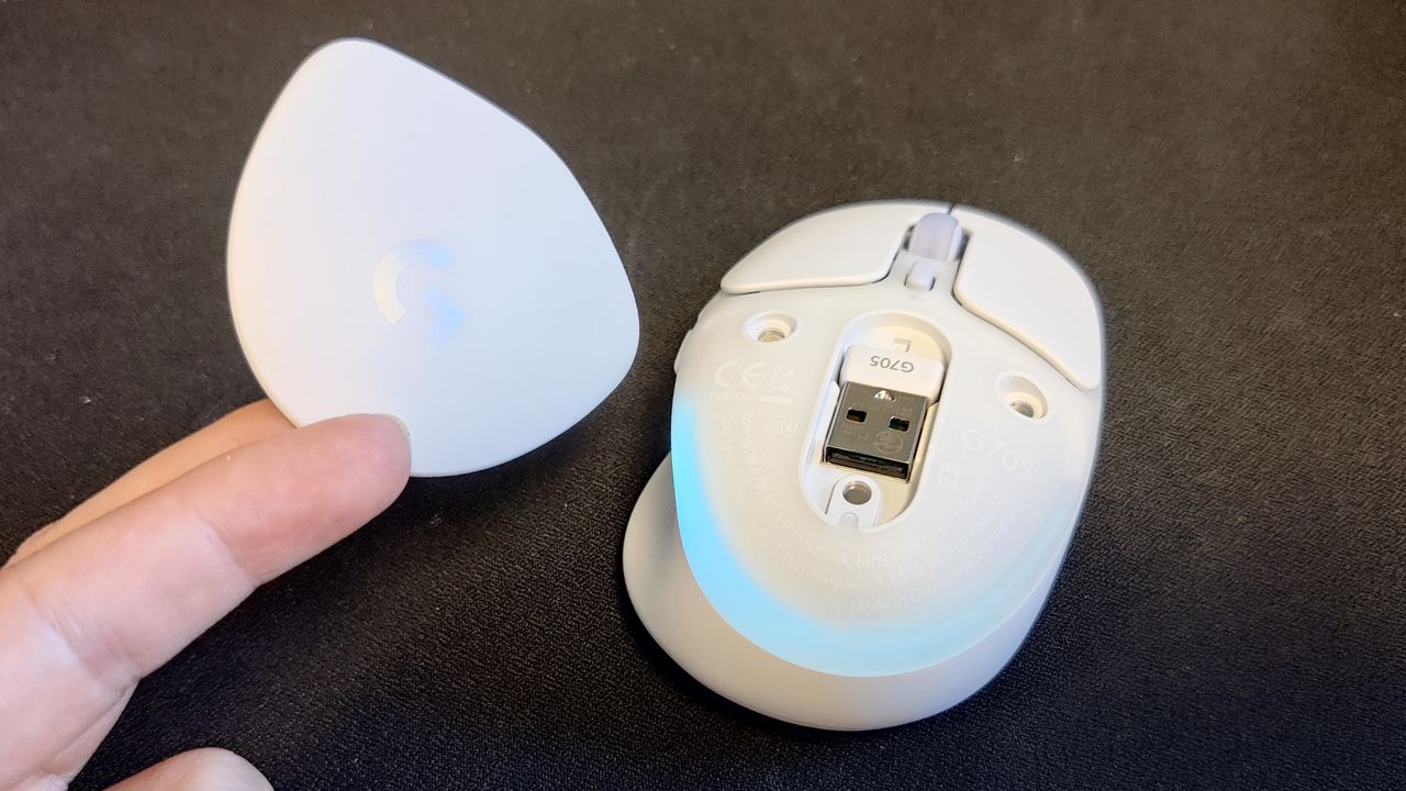 The Logitech G705 gaming mouse with the dongle showing.
