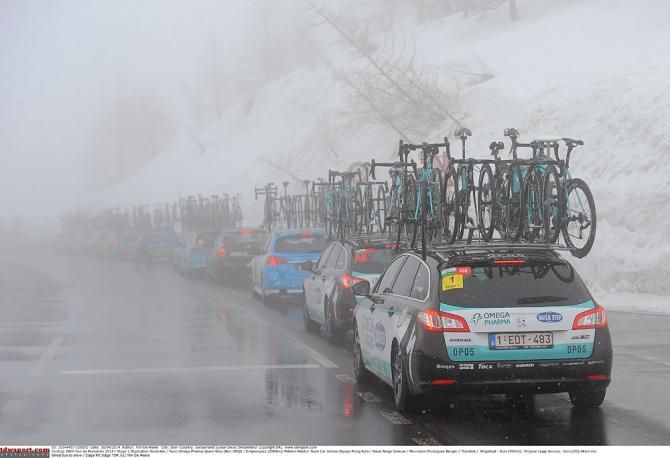 Team cars go over a pass in Romandie