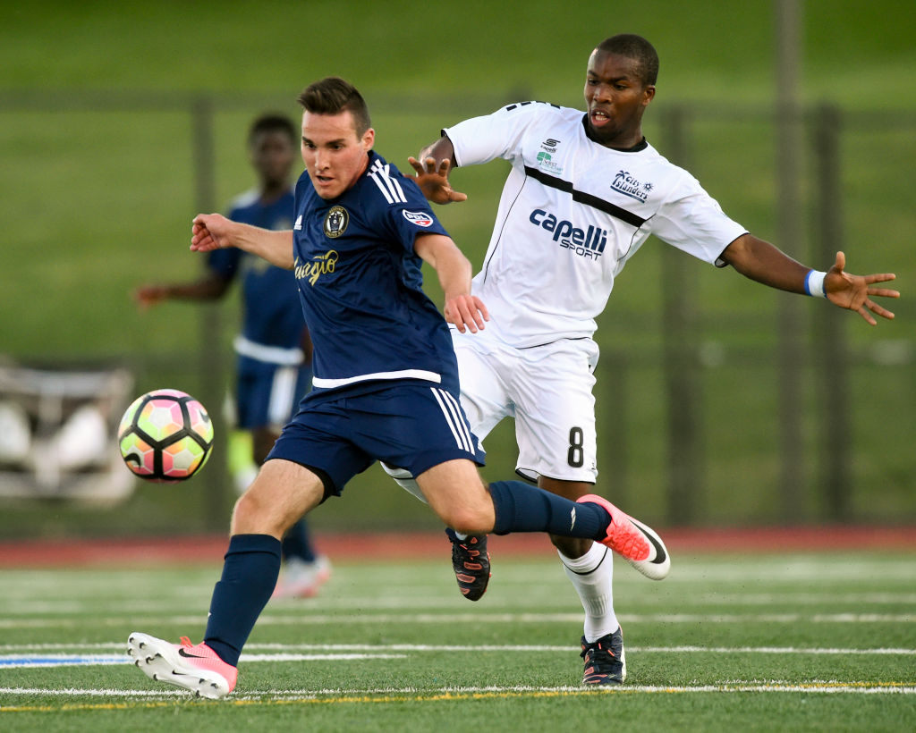 Reading United AC&#039;s Zachary Zandi looks to keep the ball away from Harrisburg City Islanders&#039; Mouhamed Dabo during the third round of the U.S. Open Cup at Exeter&#039;s Don Thomas Stadium. Harrisburg City Islanders defeated Reading United AC 3-0.