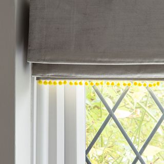 white window grey fabric with yellow trim to cover window