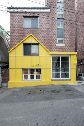 Yellow painted exterior of cafe