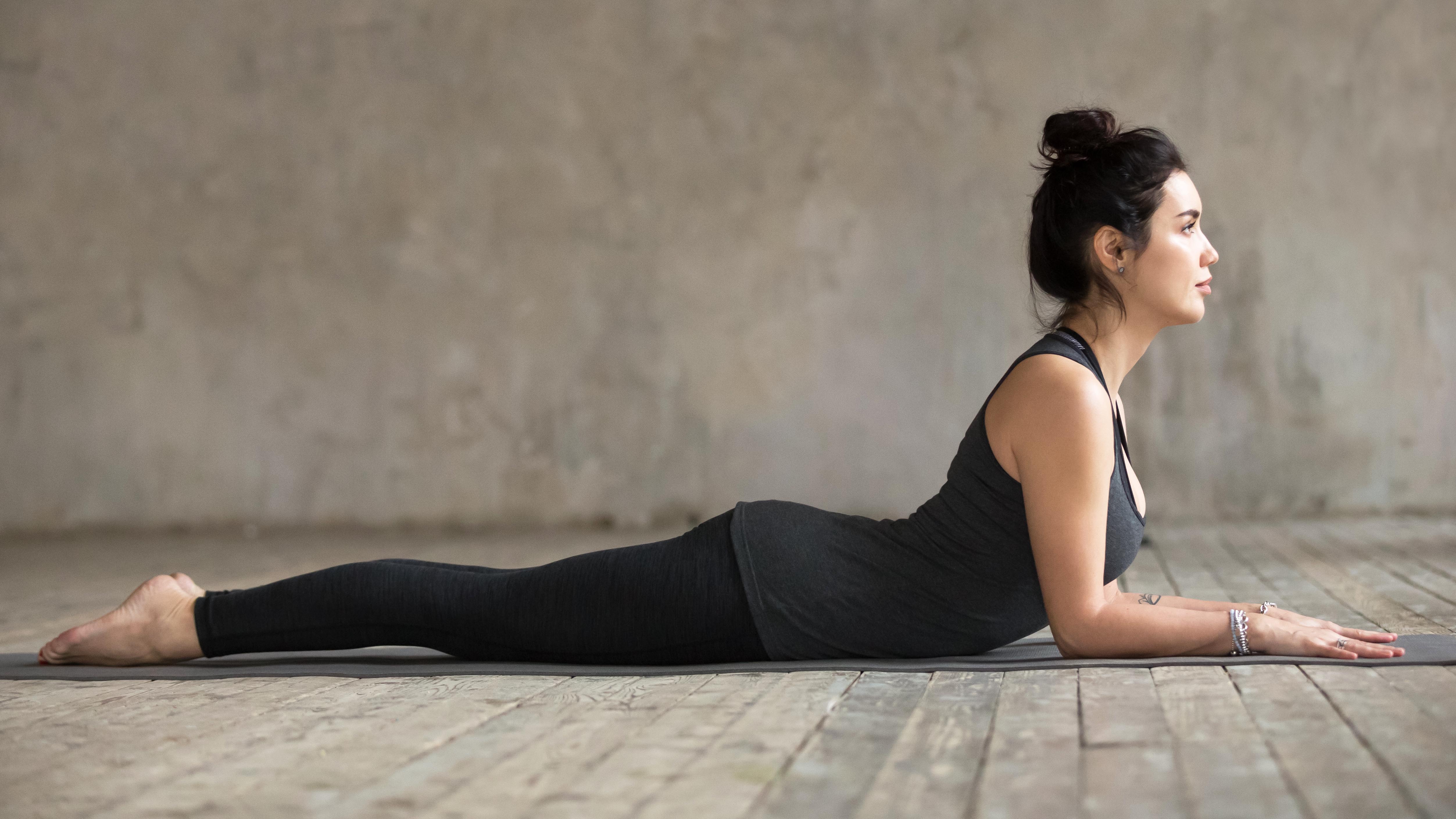 a woman doing the sphinx pose