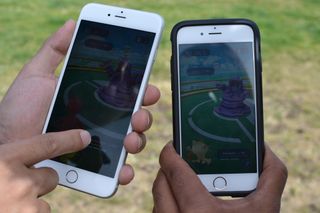 Two iPhones are shown with Pokémon Go launched.