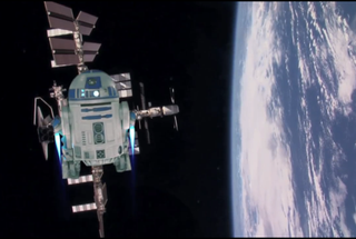 R2-D2 flies to the International Space Station to help a NASA astronaut beam a "Star Wars Day" message down to Earth.