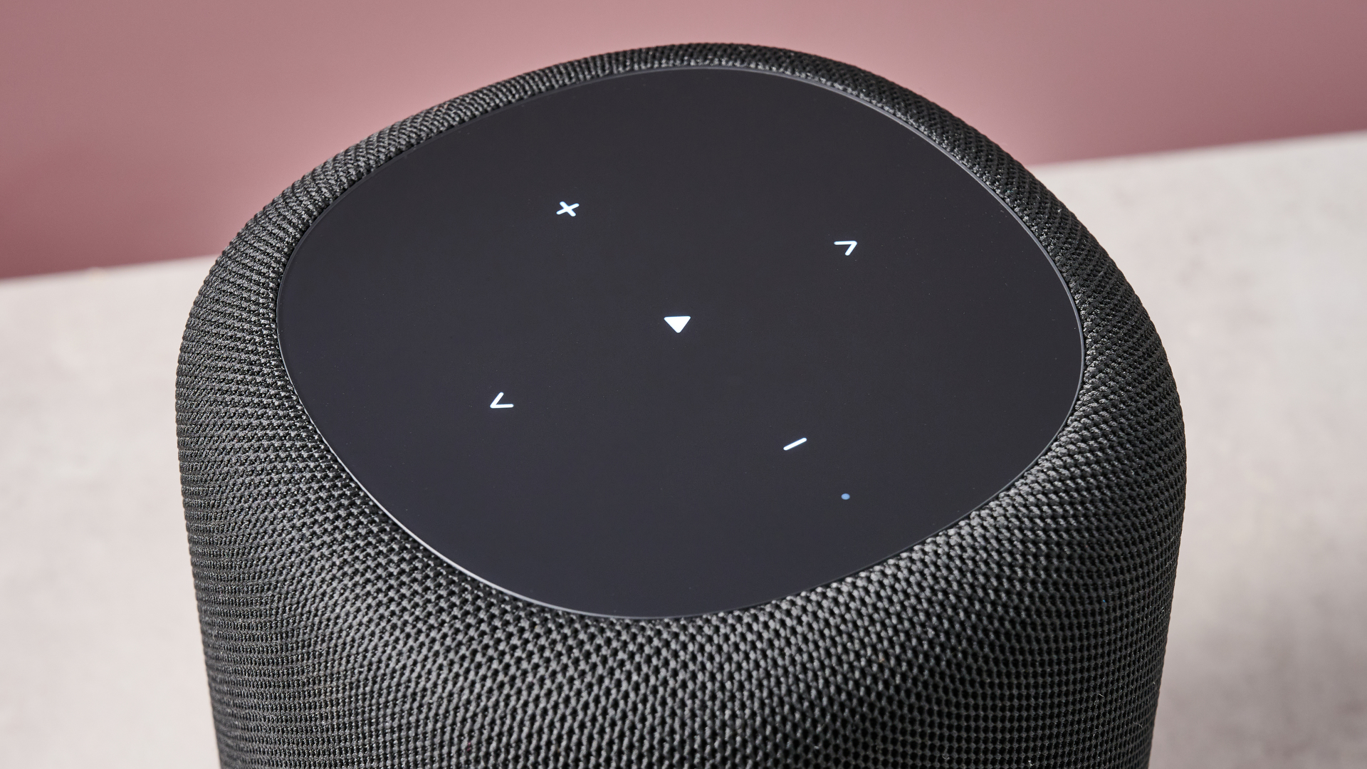 The top of the WiiM Sound Lite, showing its volume bar, and play/pause, skip and mute microphone buttons.