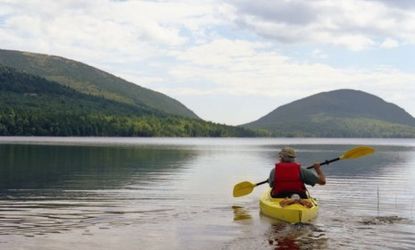 A man kayaks in Acadia National Park: The annual United State Peace Index ranks Maine as our nation&amp;#039;s most peaceful state.