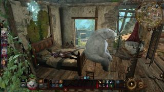 A druid using Wild Shape in Baldur's Gate 3 to sit on a bench as a bear, while their party member lies in bed behind them