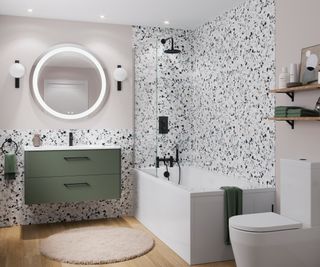 fitted white bath in bathroom with green vanity unit and terrazzo style tiles