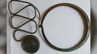 The hoard's contents included this large hook with spirals, as well as this neck ring.