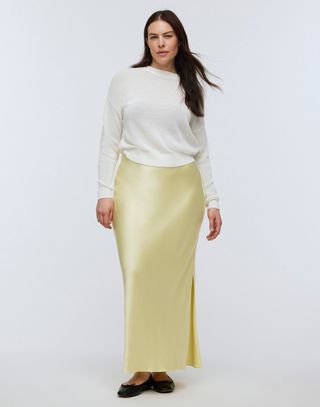 Madewell model in white top and yellow satin skirt