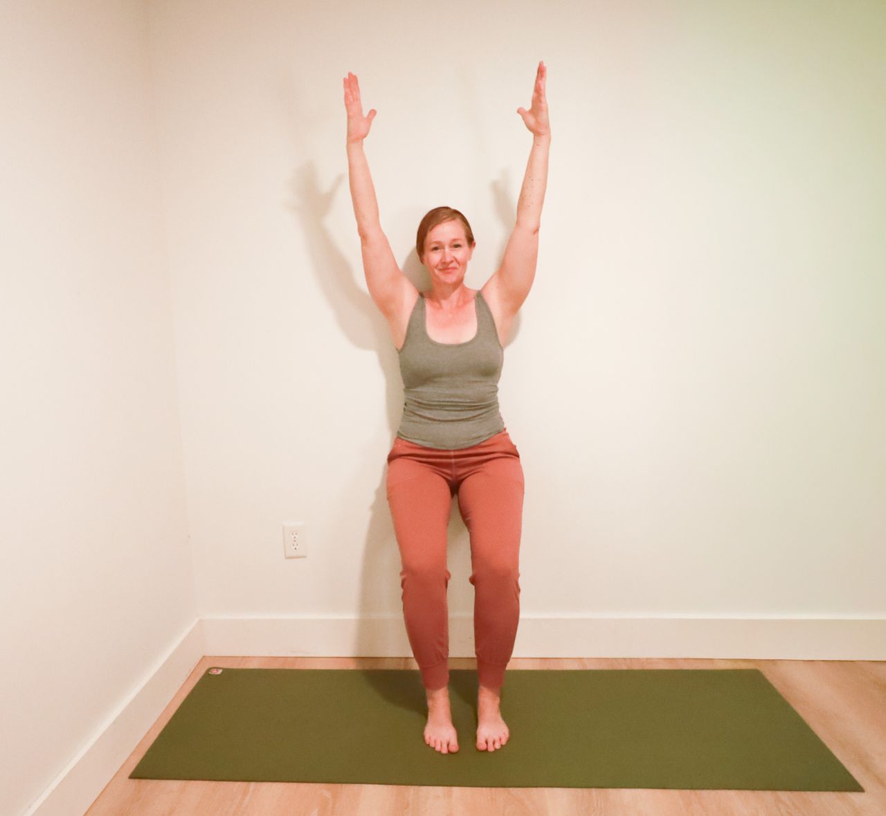 Woman demonstrates yoga pose