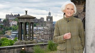 Marry Berry stands in front of a view of Edinburgh for Mary Berry: Cook and Share