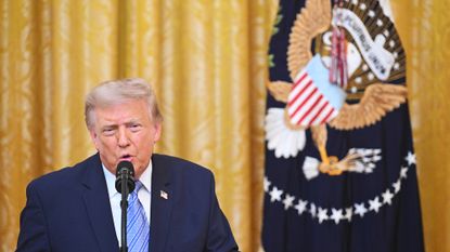 President Donald Trump speaks in the East Room of the White House