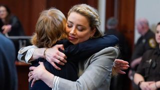 Amber Heard hugs lawyer Elaine Bredehoft in Johnny Depp trial.