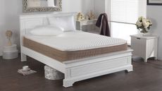 Egg crate mattress topper on bed in styled room 