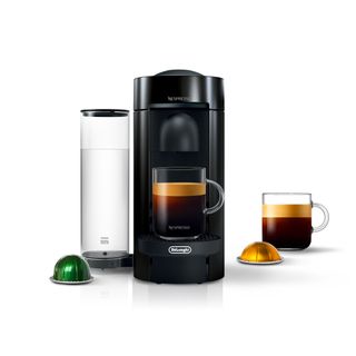 Nespresso by De'Longhi VertuoPlus, in Black with pods and a coffee cup next to it
