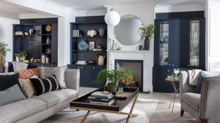 blue and white living room with hole in the wall fireplace