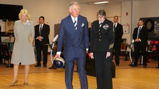 Camilla, Duchess of Cornwall looks on as Prince Charles, Prince of Wales bowls as he visits the Armed Forces Retirement home on the third day of a visit to the United States on March 19, 2015 in Washington, DC. The Prince and Duchess are in Washington as part of a four day visit to the United States.