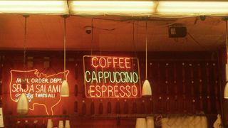 Neon sign that reads "Coffee Cappuccino Espresso"