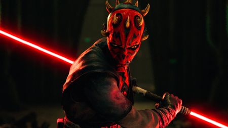 Darth Maul brandishes his dual-bladed red lightsaber in a still from Disney+'s "Star Wars: Maul - Shadow Lord"