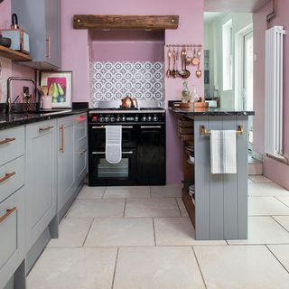 kitchen makeover with grey cabinets and pink wall