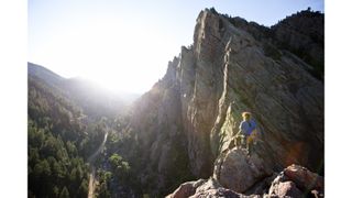 A rock climber in Eldorado Canyon Colorado at sunrise