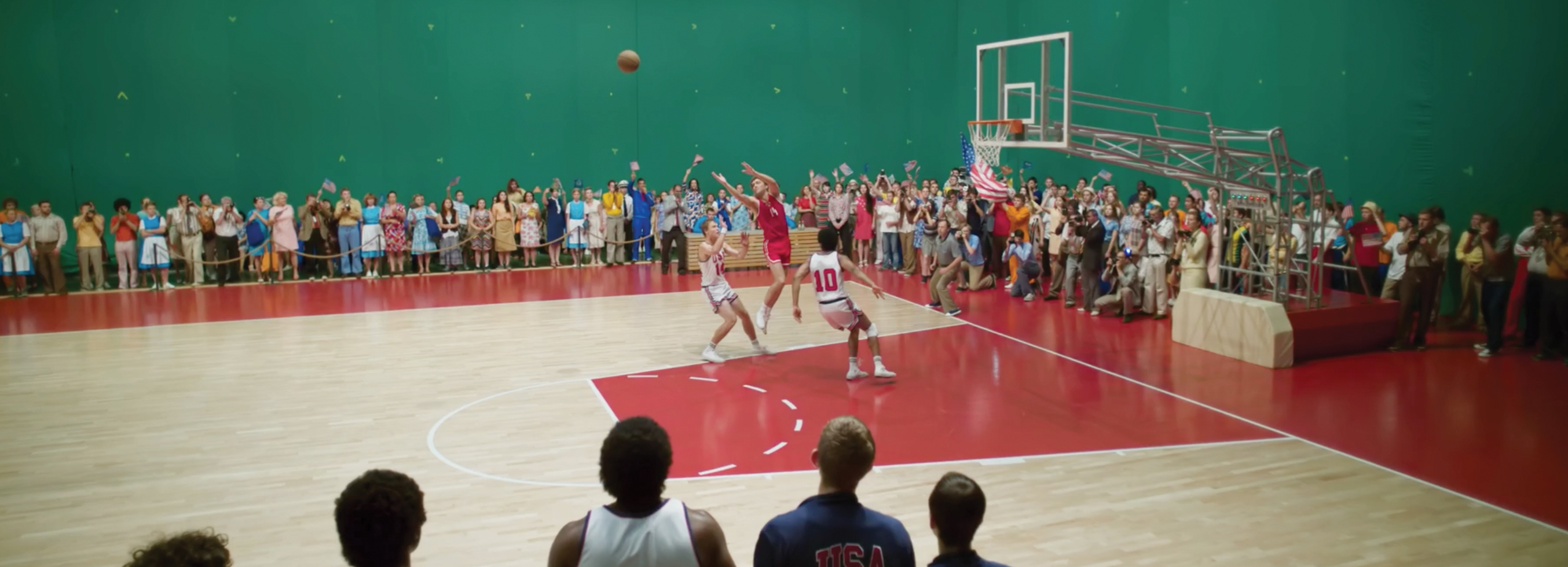 A basketball court shot against a greenscreen