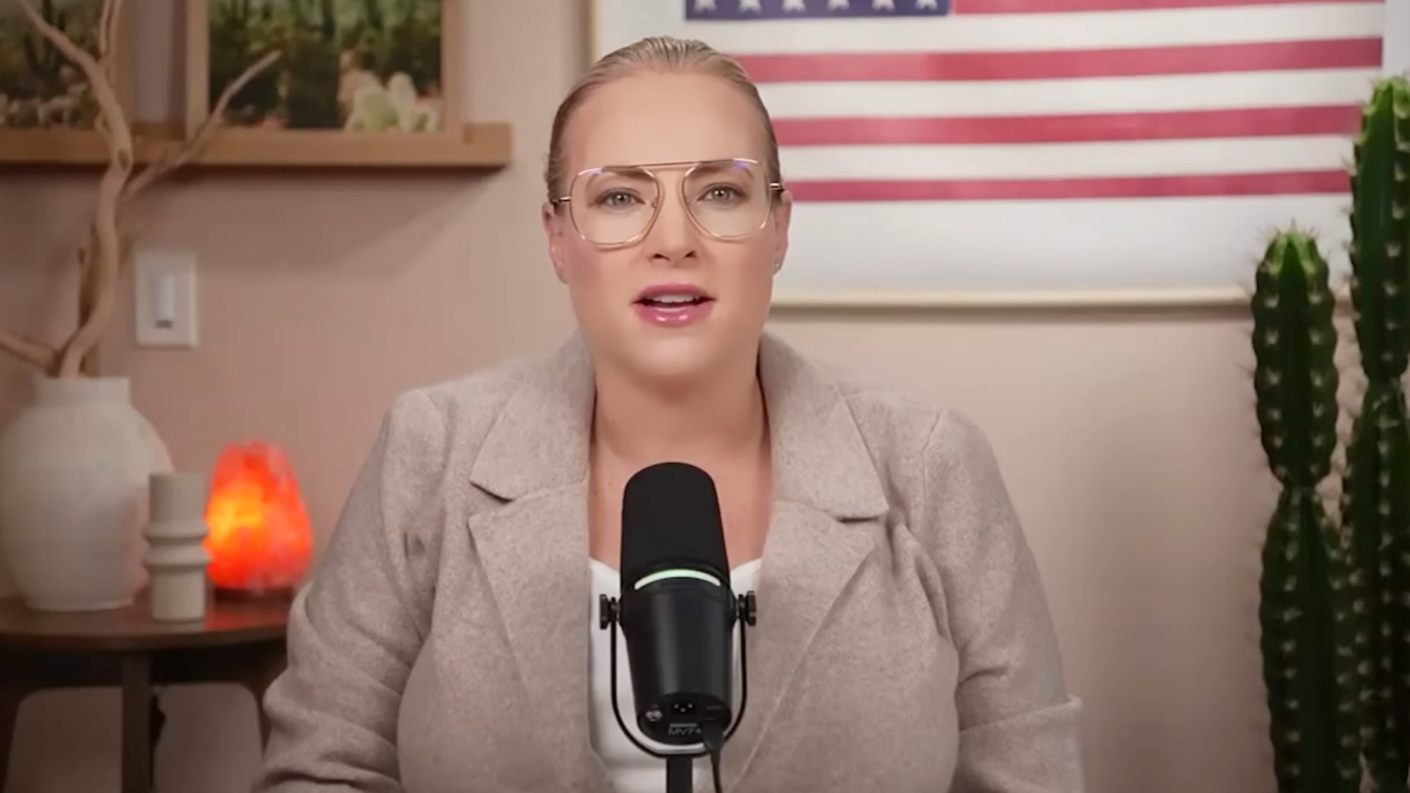 Meghan McCain talking into a mic on Critizen McCain. 