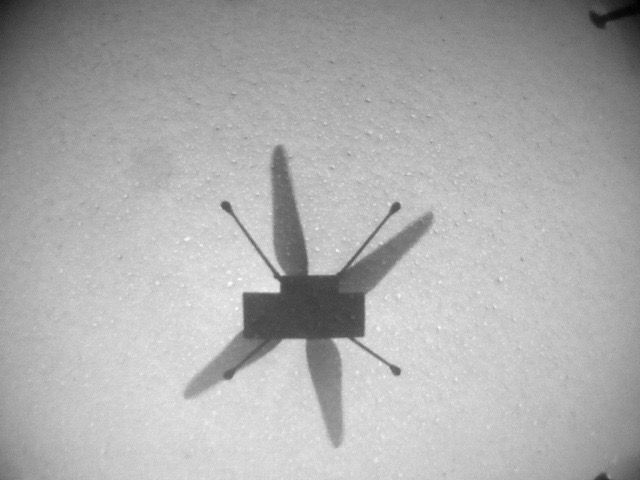 NASA&#039;s Mars helicopter Ingenuity took this photo of its own shadow with its navigation camera during its seventh Red Planet flight, on June 8, 2021.