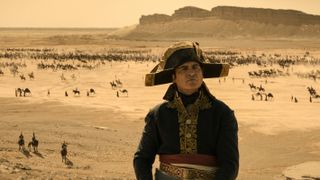 Napoleon (Joaquin Phoenix) seen in the desert in the Apple Original movie