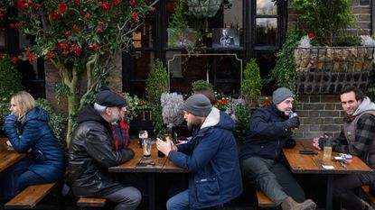 Drinkers outside a pub in Windsor