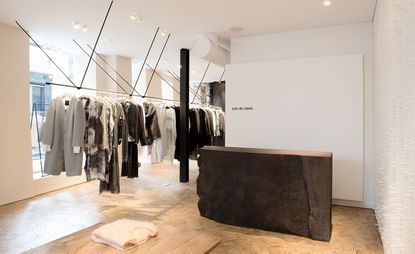 Monochrome clothing rail inside store