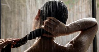 a photo of a woman in the shower