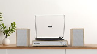 Victrola Harmony turntable and speaker system in natural on a sideboard