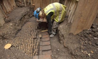 An archaeologist helps unearth what experts believe are the remains of an Elizabethan theater that once staged Shakespeare's earliest plays.