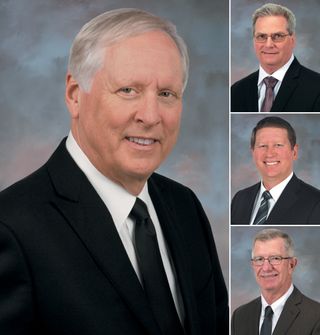 Extron founder and president Andrew Edwards pictured smiling with the headshots of his three C-suite members.