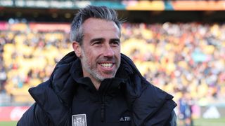 Spanish Women's football coach Jorge Vilda smiles on pitch at the Women's World Cup