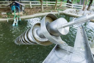 The Archimedes screw is a machine used for transferring water from a low-lying body of water into irrigation ditches.