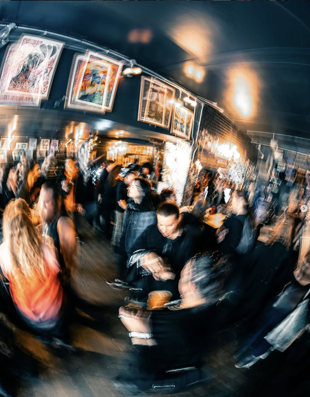 a photograph of a crowd chatting and drinking at The Black Heart's annual SUMMER MARKET which helps raise money for local charities
