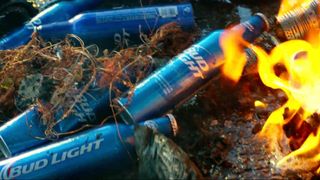 After a conveniently placed Bud Light truck is smashed to pieces, the distinctive blue bottles are strewn everywhere