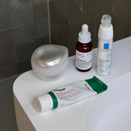Photo of skincare products on a bathroom sink