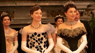 Carrie Coon and Donna Murphy standing together at the ball in The Gilded Age.