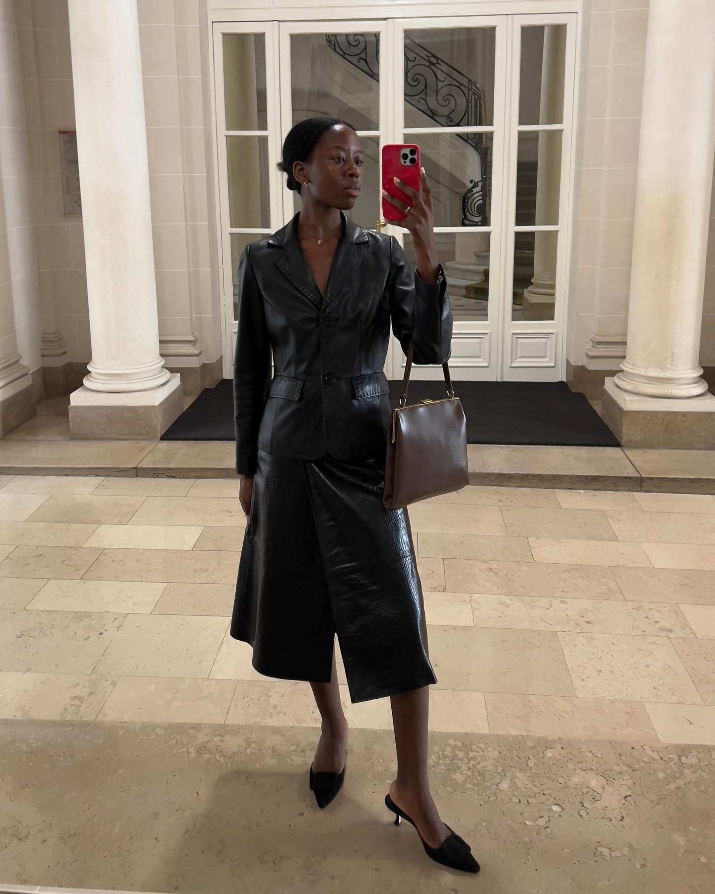 Sylvie Mus carrying a kisslock bag