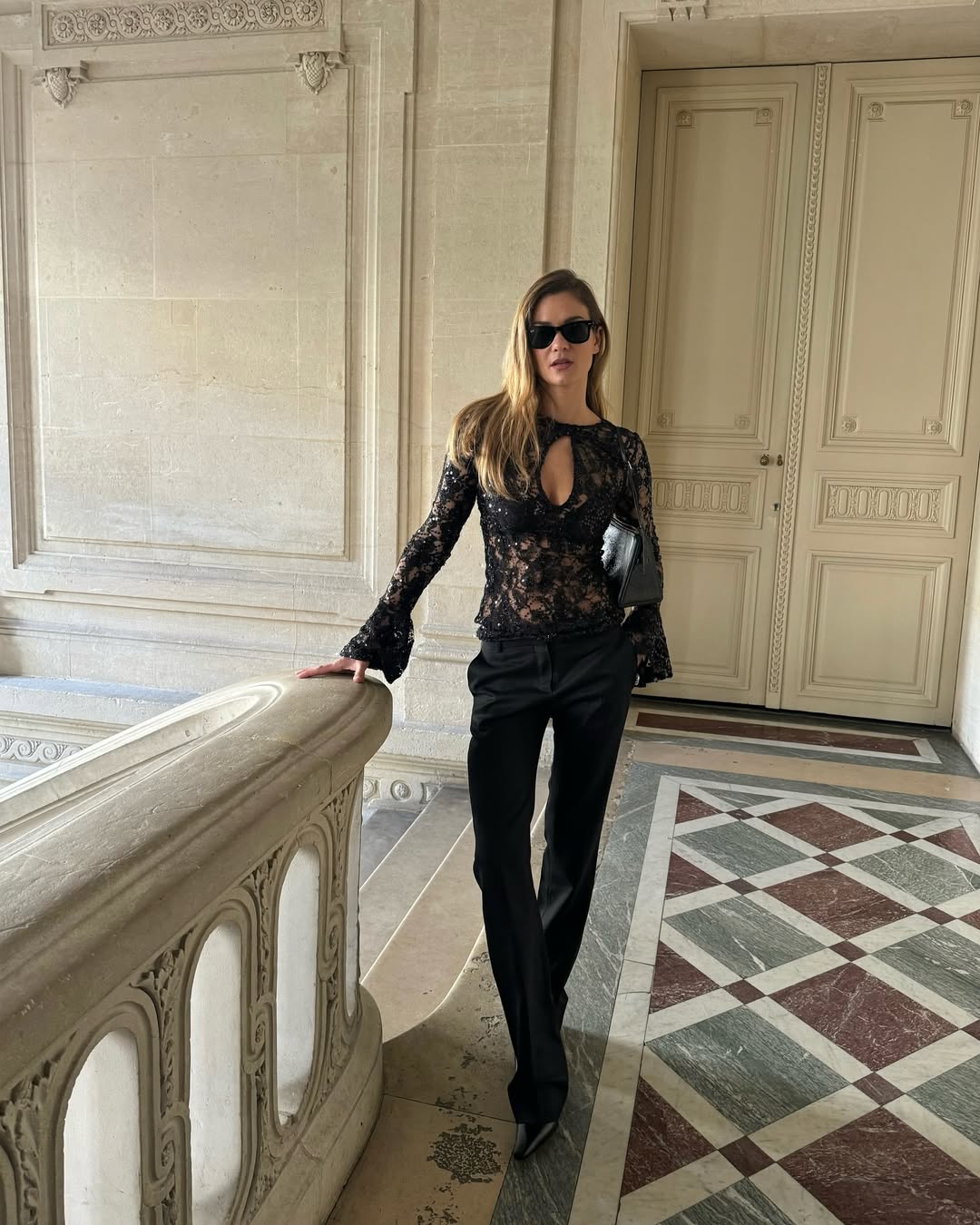 Anne-Laure Mais wears skinny pants and toe ankle boots