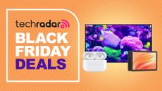 Assorted tech products on orange background with black friday deals text overlay