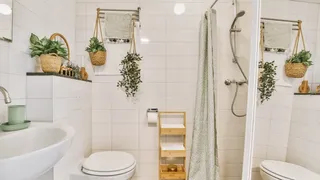 White bathroom with patterned shower curtain