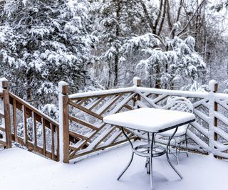 snowy patio and outdoor furniture