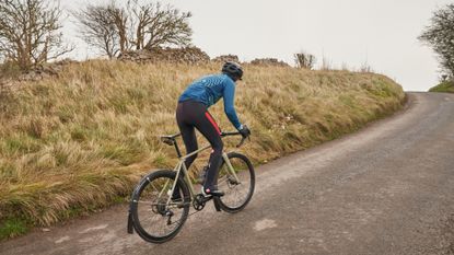 Male cyclist riding a bike that is set up with fenders / mudguards