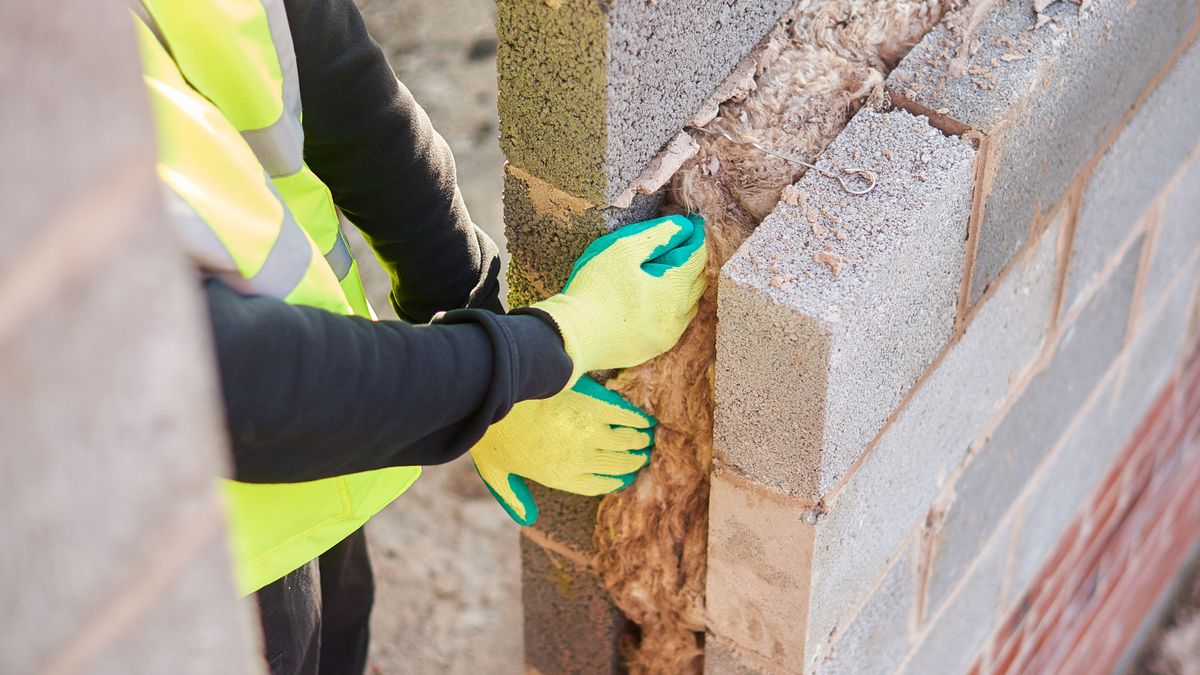 builder insulating a wall